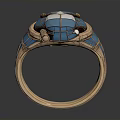 Decorative Blue Inlaid Ring With Metallic Band And Intricate Geometric Design