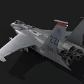 Gray Military Fighter Jet With Cockpit Attached Missiles And Tail Number 227