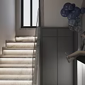 Modern Gray Staircase Interior With Glass Railing Illuminated Steps And Blue Spherical Decorative Lights
