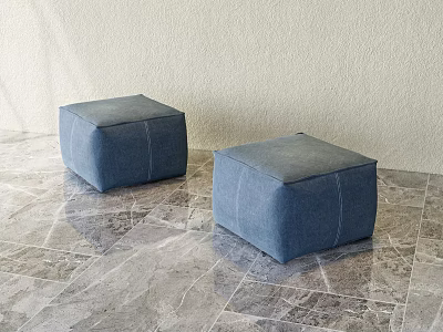Two Blue Square Upholstered Ottomans On Marble Textured Floor With Light Wall 3d model