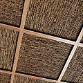 Natural Woven Ceiling Design With Wooden Grid Frame And Textured Patterns