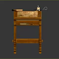 Wooden Reading Table with Scroll Candle and Green Book on Top
