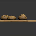 Three Nutty Bread Loaves Placed On Wooden Cutting Board