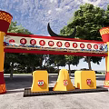 Red And Yellow Decorative Columns Archway With Banner And Yellow Structures Below 3d model