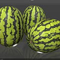 Three Juicy Watermelons with Green and Black Stripes on Shiny Surface