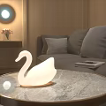 Elegant Swan Shaped White Decorative Lamp On Marble Coffee Table In Cozy Living Room
