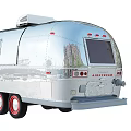 Shiny Silver Vintage Trailer With Shiny Exterior Red Wheels And Classic Design
