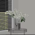 Transparent Glass Vase With White Flowers On Round Metal Table By Window Blinds
