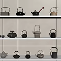 Stylish Various Tea Pots Arranged On White Shelves With Light Walls And Small Plants
