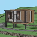Modern Boutique Guesthouse With Glass Walls Wooden Structure And Elevated Platform In Lush Green Setting