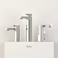 Three Modern Roca Faucets Displayed On White Countertop With Sleek Design 3d model
