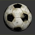 Vintage Black And White Soccer Ball With Worn Texture On Dark Reflective Surface