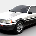 Classic White Two Door Car With Black Stripes And Alloy Wheels