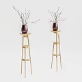 Red Ceramic Vases With Slender Branch Flowers Placed On Wooden Stands In Minimalist Light Background