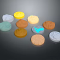 Colorful Round Cookies with Various Textured Surfaces and Assorted Colors on Dark Background