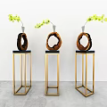 Elegant Wooden Ring Decorations On Golden Stands With Yellow Flower Branches
