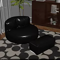 Black Leather Round Single Sofa With Matching Ottoman On Patterned Rug In Living Room