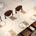 Modern Dining Table Set With Chairs Pendant Lights And Flower Vase On Countertop