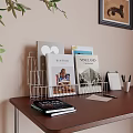 Books And Magazines Organized In Wire Rack On Wooden Desk With Calendar Pens And Papers