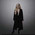 Woman With Long Blonde Hair Standing In Black Coat And Black Boots On Gray Background