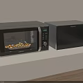 Two Sleek Black Microwave Ovens With Digital Display As Modern Kitchen Appliances