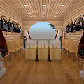 Wooden Interior Display Space With Hanging Black Bags And Glass Top Cases