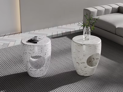Round Speckled Side Tables With Hollow Design In Living Room With Sofa Vase And Books 3d model