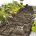 Japanese Garden Stone Path With Lush Green Plants And Traditional Lantern