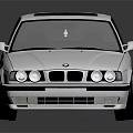 Classic White BMW Sedan With Sleek Body Lines And Black Wheels