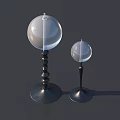 Decorative Ornament Set with Large and Small Glass Spheres on Black Spiral Bases