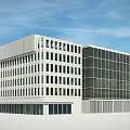 Modern Office Building Exterior With Glass Facade And White Architectural Structure