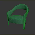 Green Velvet Armchair With Curved Armrests And Decorative Studs Design