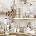 Bathroom Essentials Display With Golden Shelves Rolled Towels And Decorative Bottles