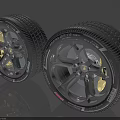 Two Modern Automotive Tires with Alloy Wheels and Detailed Tread Design