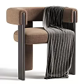 Modern Beige Fabric Upholstered Single Armchair With Sleek Dark Metal Frame And Cozy Throw Blanket