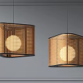 Two Bamboo Pendant Lights with Hollow Out Design and Warm Illumination Against Grey Wall