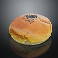 Golden Brown Bun Topped With Black Sesame Seeds On Black Background With Reflection