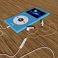 Blue iPod With White Earphones On Wooden Surface And Screen