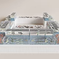 Large Aquarium Display With Multiple Glass Fish Tanks Filled With Aquatic Life And Tiled Base