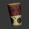 Homemade Traditional Snacks In Red White Black Patterned Cylindrical Container With Yellow Rim