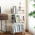 White Multi Tier Bookshelf With Various Books And Magazines In Home Room Corner