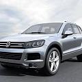 Silver Volkswagen SUV With Front Grille Design And Alloy Wheels On Open Road