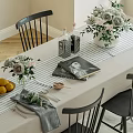 Dining Table Set With Tablecloth Black Chairs Wooden Legs And Flower Centerpiece