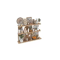 Stylish Kitchenware Display On Wooden Shelves With Bowls Plates Jars Mugs Cutting Boards And Plants