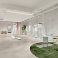 Modern Clothing Store Interior With Fashion Apparel Displays And Glass Staircase Design