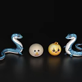 Decorative Ornament Set With Blue Snake Shaped Figures White And Yellow Smiley Balls
