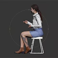Woman In White Shirt And Blue Denim Skirt Sitting On White Stool With Brown Boots