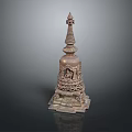 Ancient Carved Stone Tower with Ornate Base Spire and Intricate Traditional Design