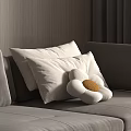 Cozy White Pillows And Flower Shaped Cushion With Yellow Center On Gray Sofa