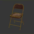 Vintage Red Folding Chair With Worn Metal Frame And Simple Background